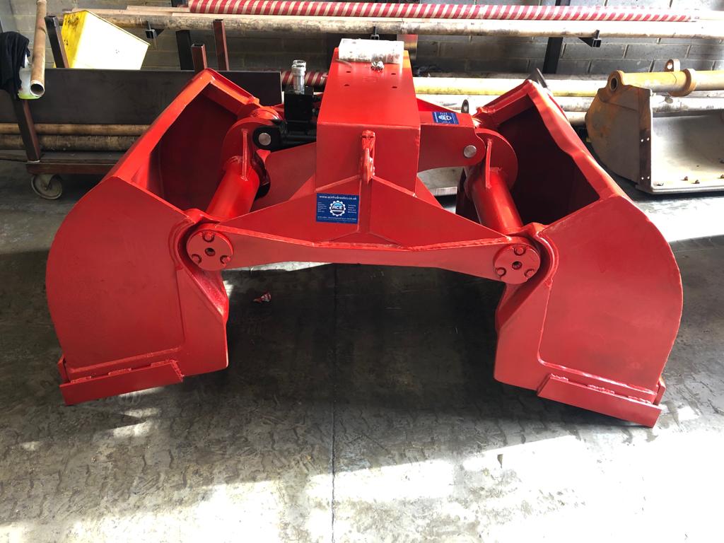 Refurbished red hydraulic grab at ACE Hydraulics